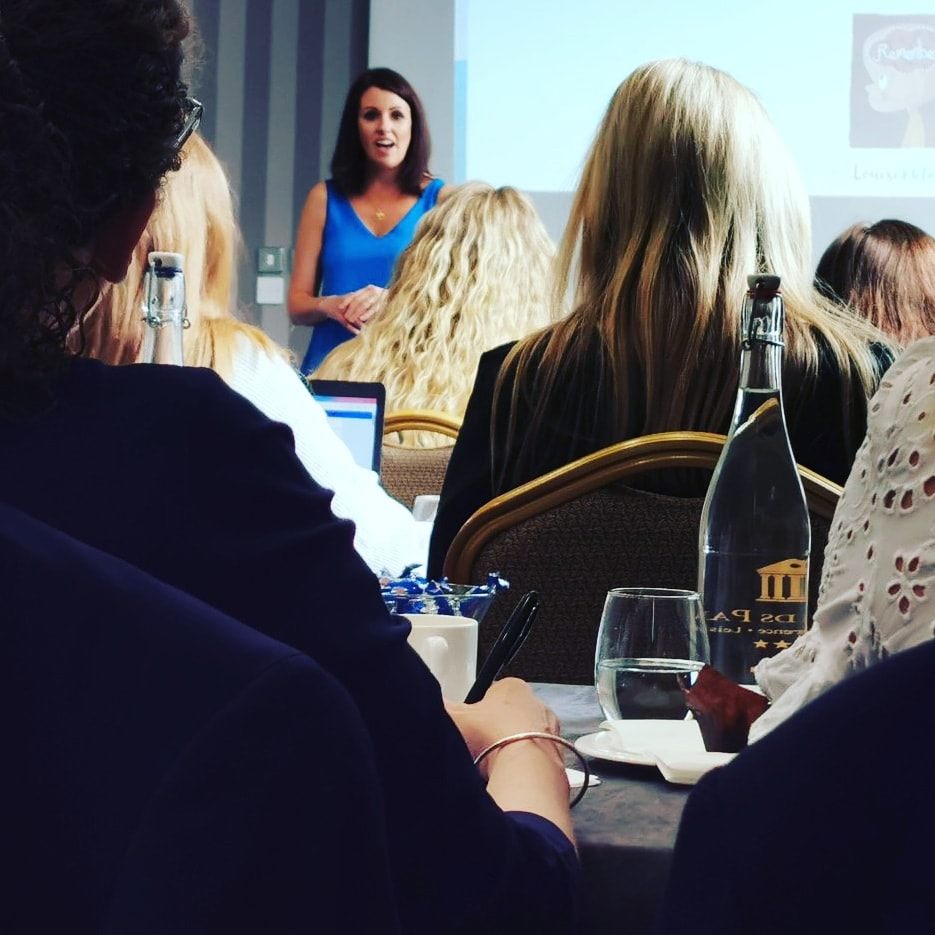 Louise McDonnell delivering a marketing training session to a business audience